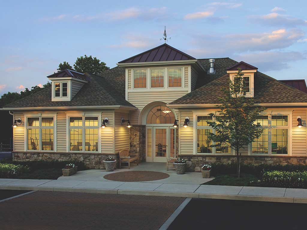 Exterior of The Landings’ Clubhouse for residents at sunset.