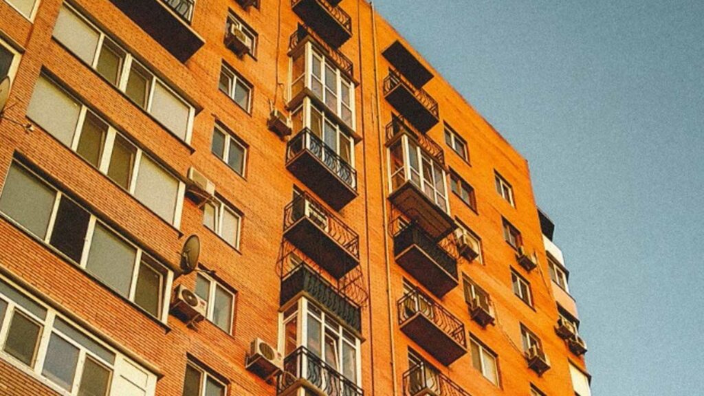 Exterior of an apartment building showing windows and balconies