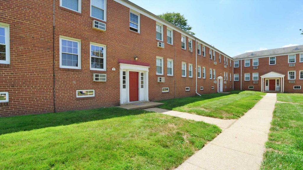 Exterior of Oak Grove apartments with well-kept lawns and walkways