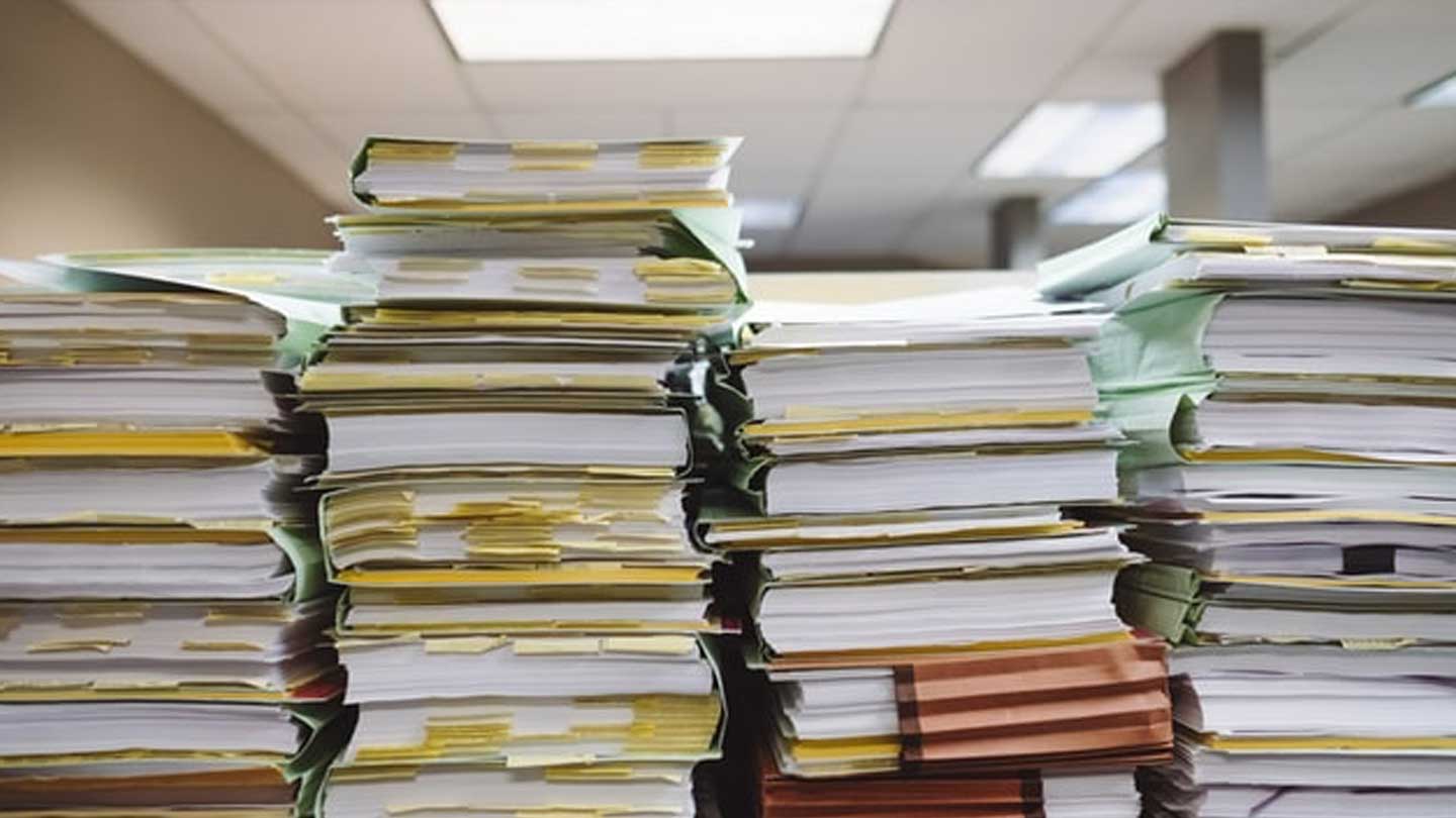 Stack of files and papers in an office