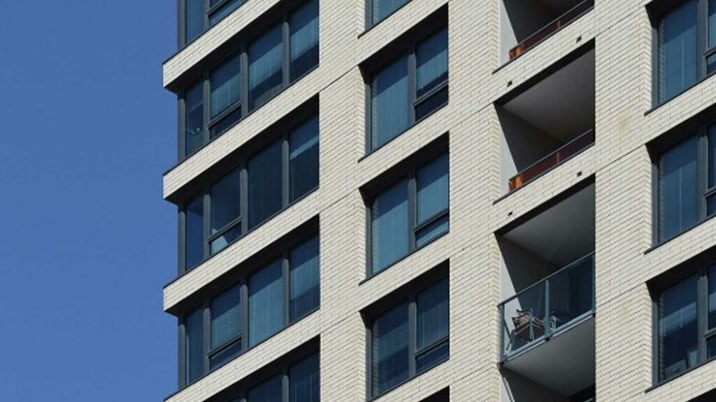 Exterior of a multifamily building windows and balconies